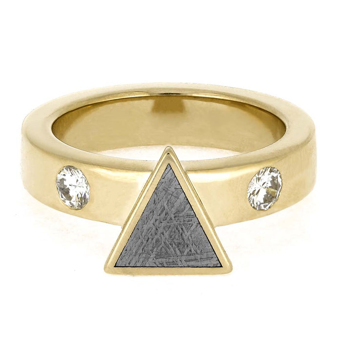Gold ring with a triangle and two crystals on a white background