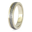 Gold ring with a textured metallic inlay on a white background