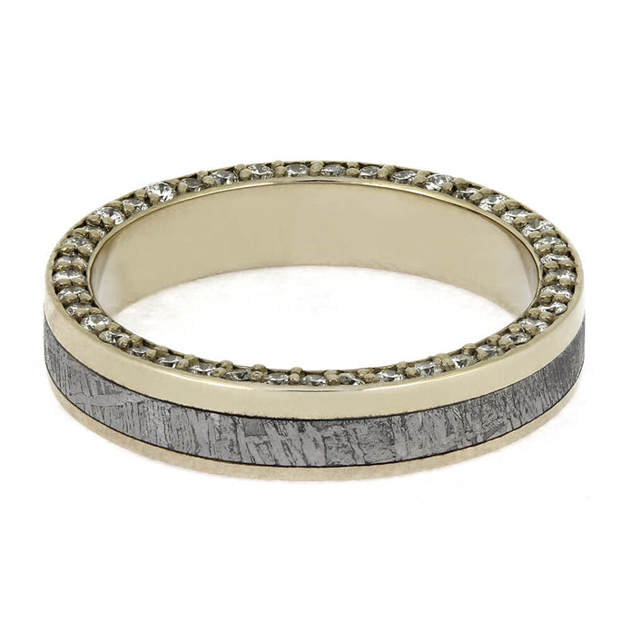 Gold ring with gray textured band and diamond accents on a white background