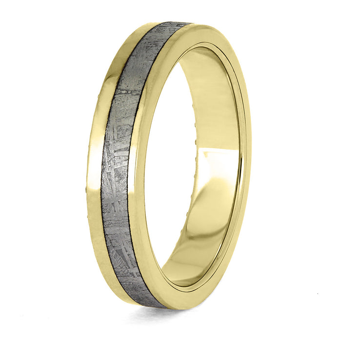 Gold ring with a textured gray center on a white background