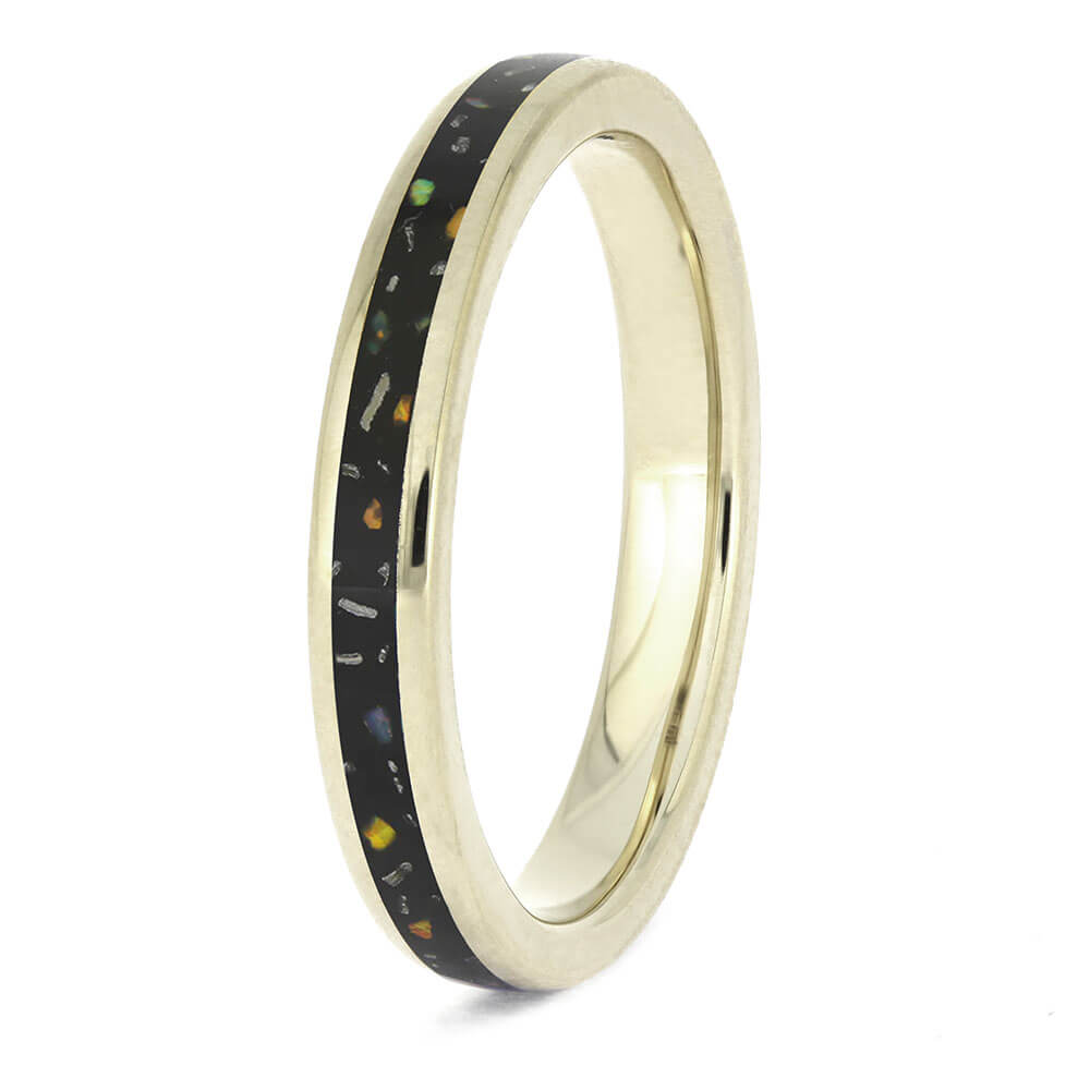 Angled view of Black Opal Stardust Wedding Band for Women, 14k white gold with black inlay of crushed opal and meteorite.