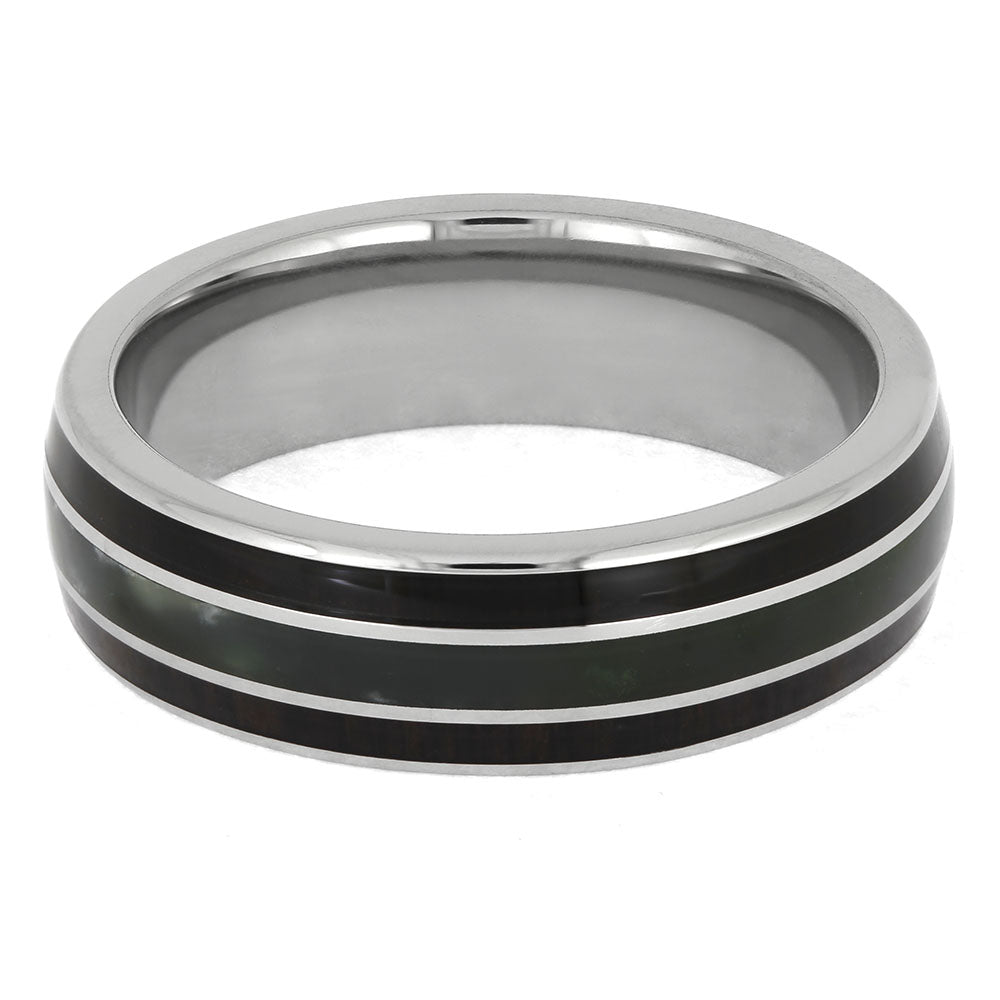 Silver ring with black inlay on a white background