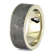Two-tone ring with gold and gray textured band on a white background