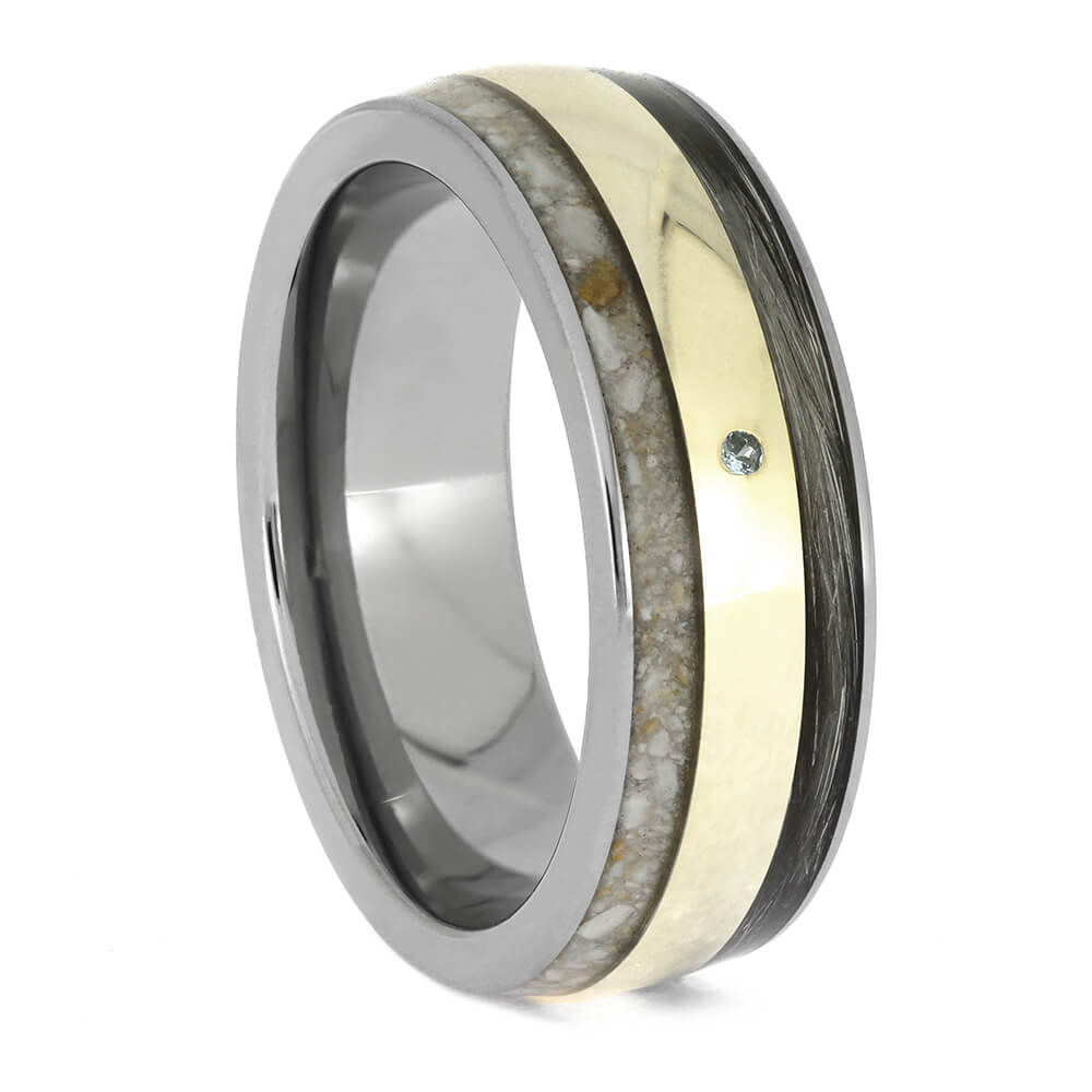 Multicolored ring with metallic and wooden inlay on a white background