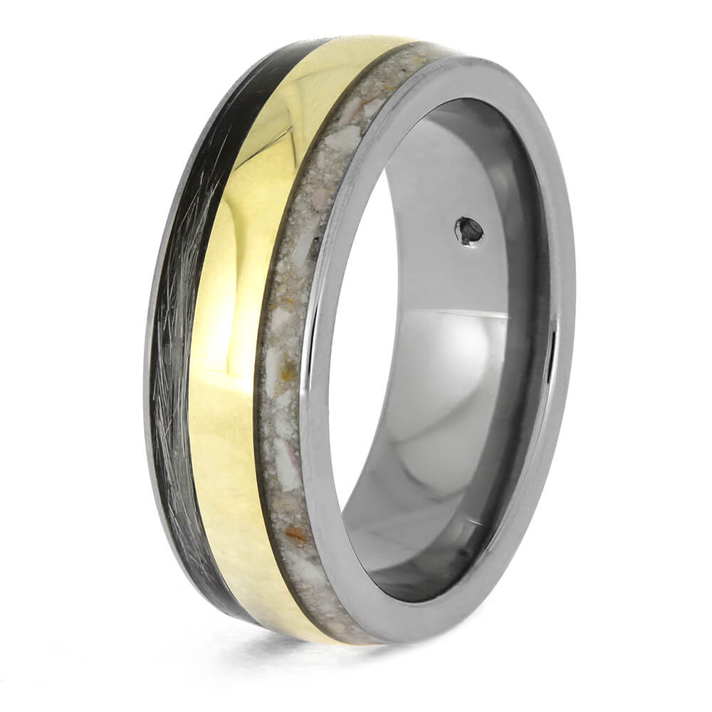 Ring with gold and silver band on a white background