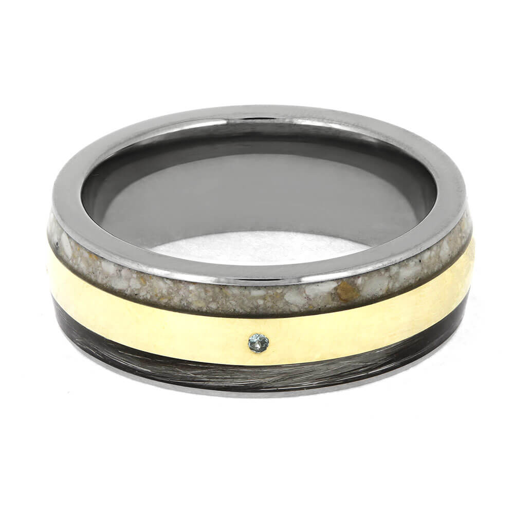 Ring with gold and black band on a white background