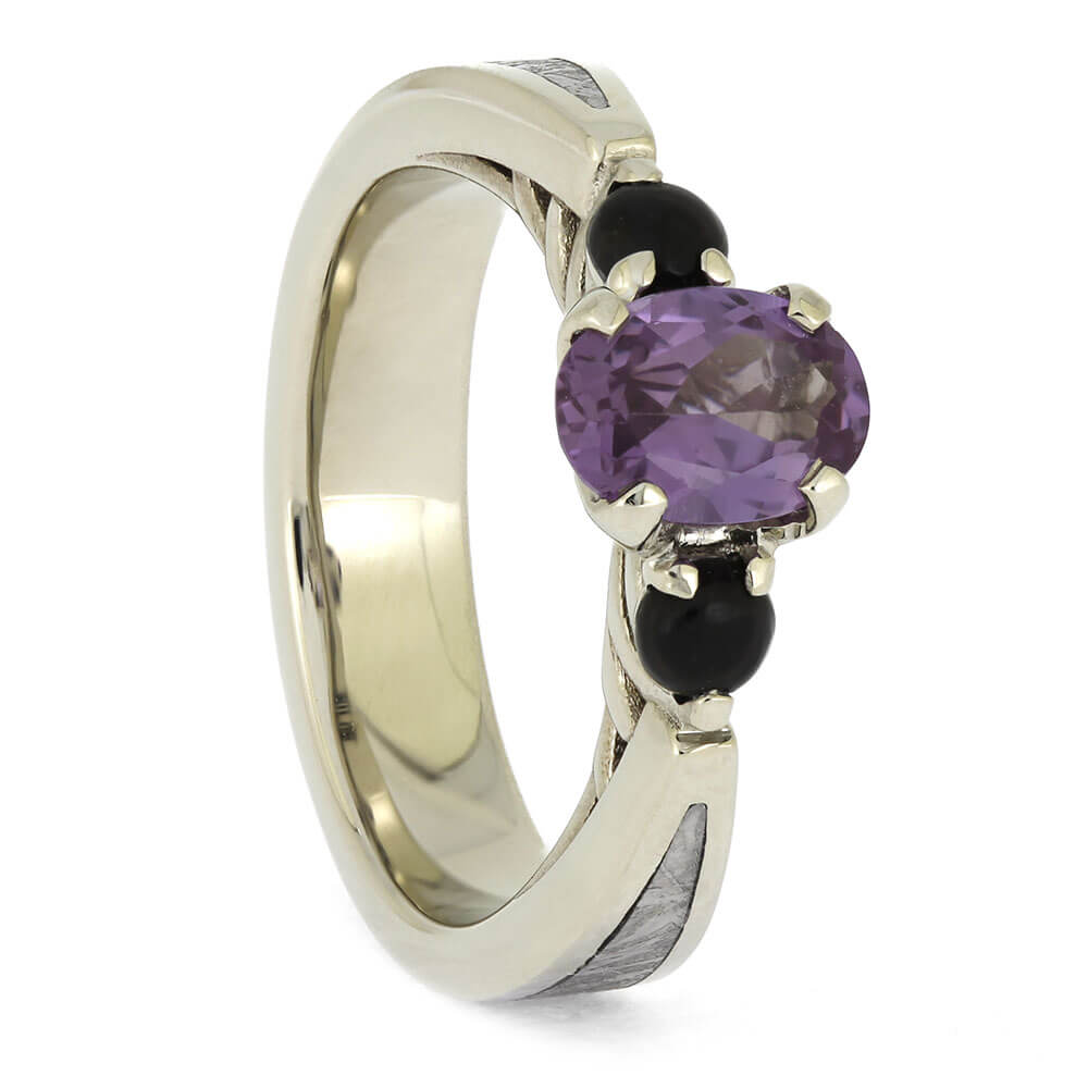 Unique Three Stone Ring with Onyx and Meteorite in polished white gold, showcasing a purple alexandrite flanked by black onyx stones.