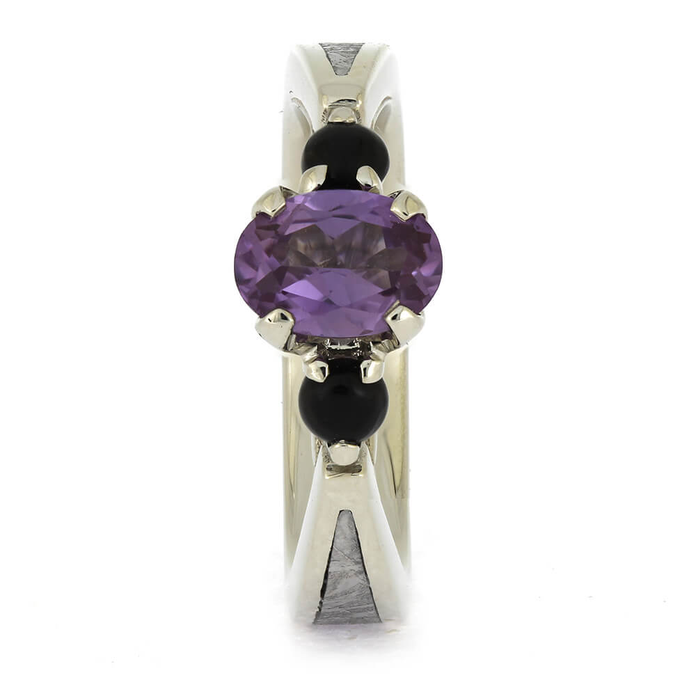 Front view of Three Stone Ring with Onyx & Meteorite, highlighting the prong-set alexandrite and contrasting black onyx side stones.
