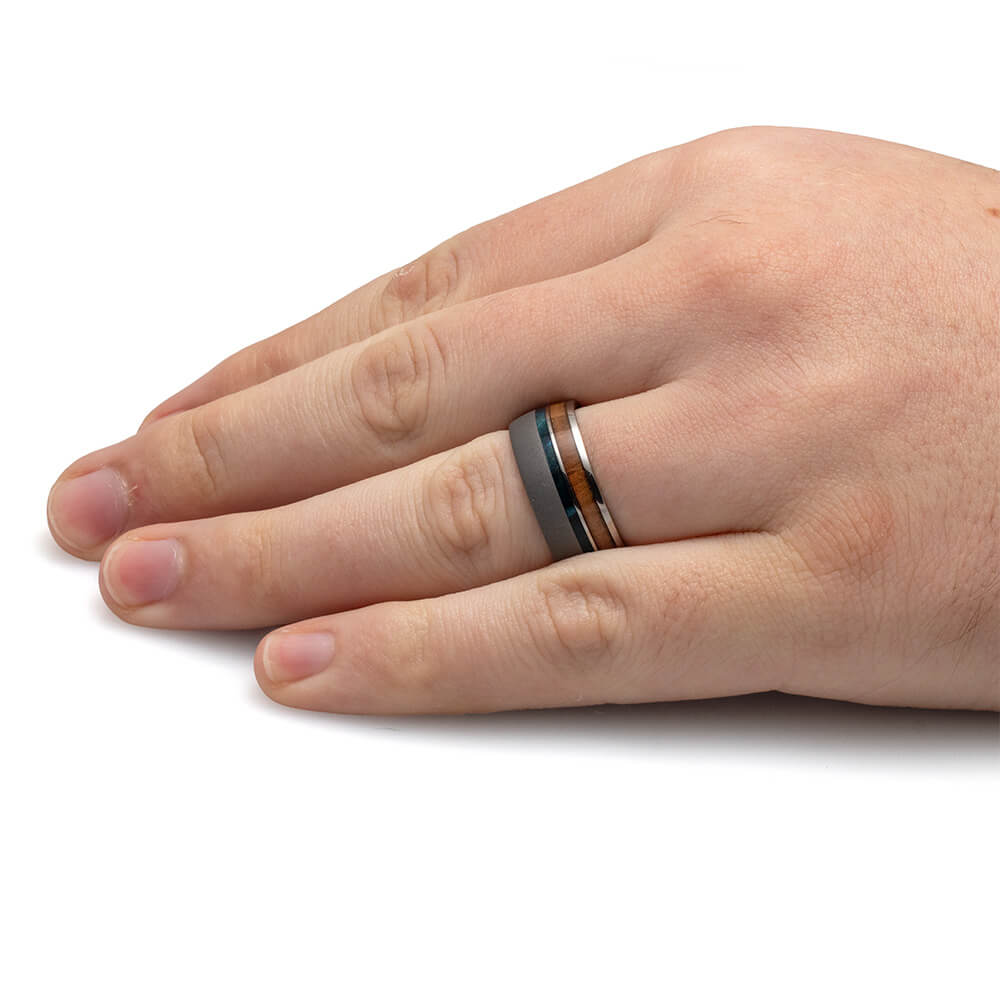 Hand wearing a ring with a white background