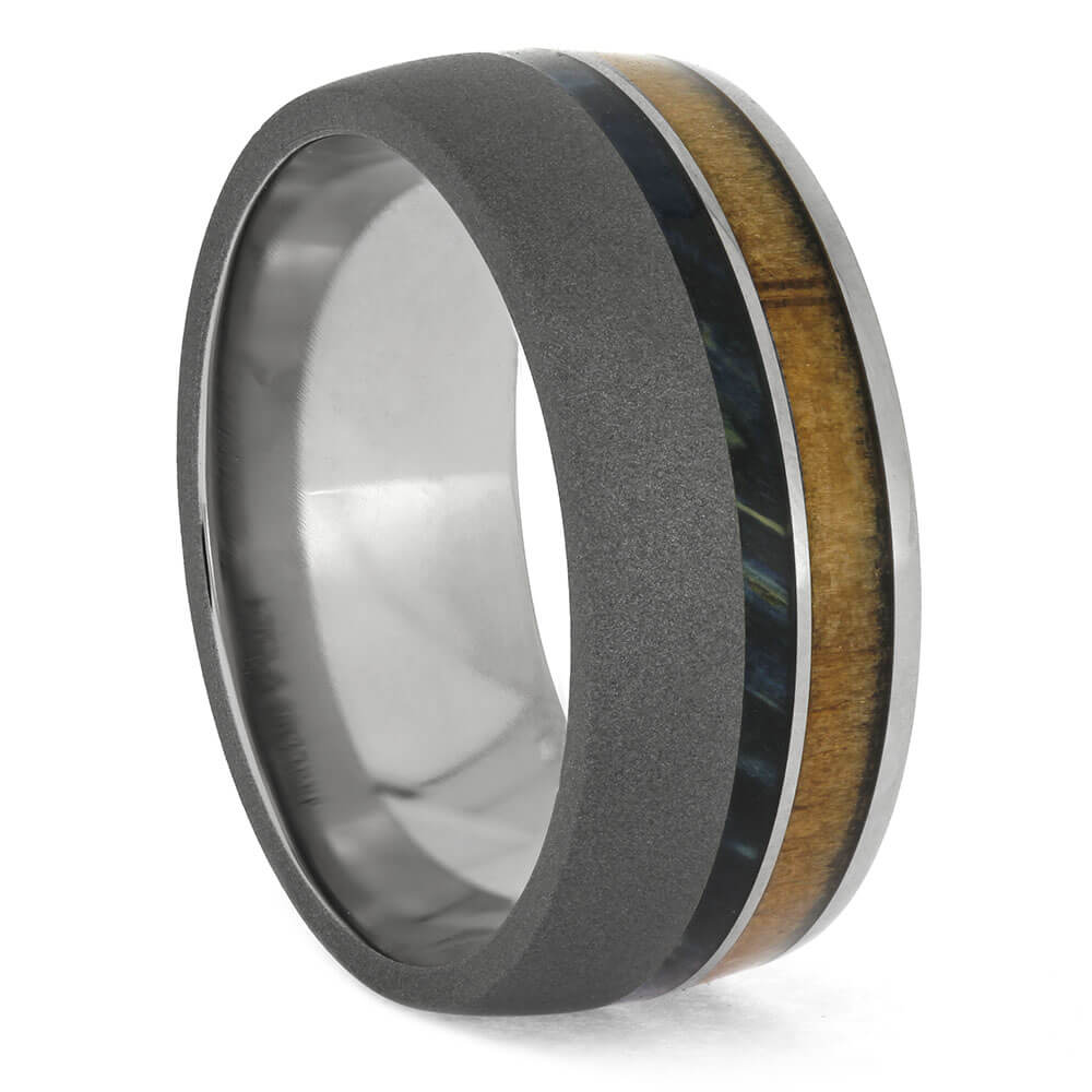 Ring with wooden inlay on a white background