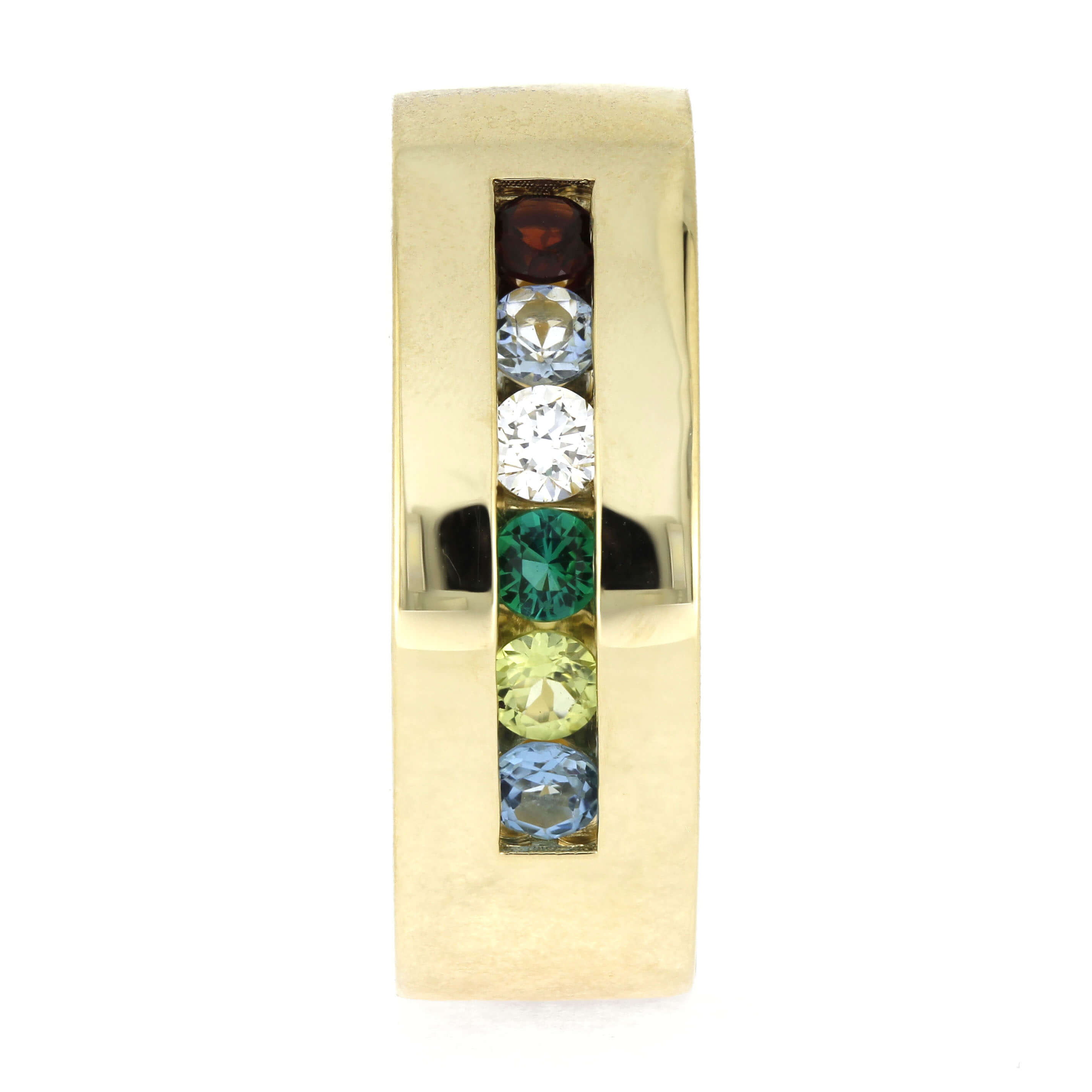 Gold ring with colorful gemstones on a white background