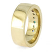 Gold ring with embedded gemstones on a white background