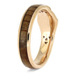 Gold ring with a wooden inlay on a white background