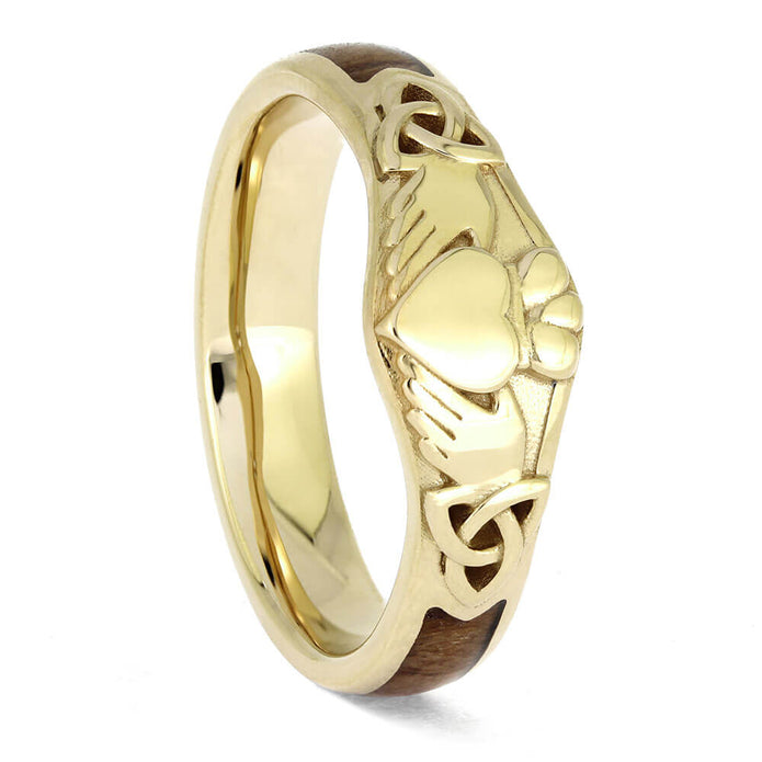 Gold ring with Celtic design on a white background