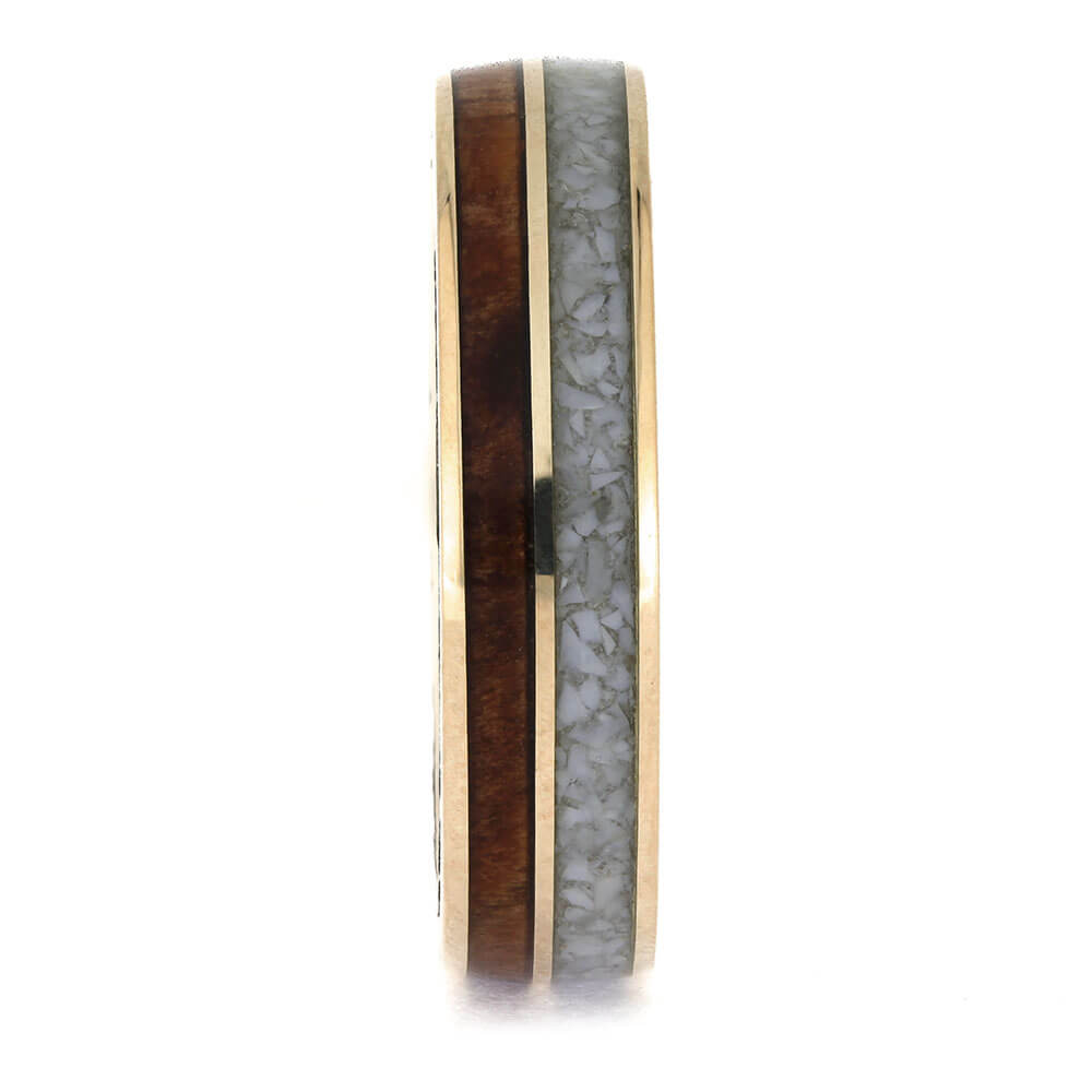 Ring with wooden and gray stone inlay on a white background