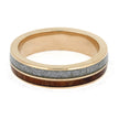 Gold ring with gray and brown inlay on a white background