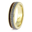 Gold ring with a wooden and gray inlay on a white background