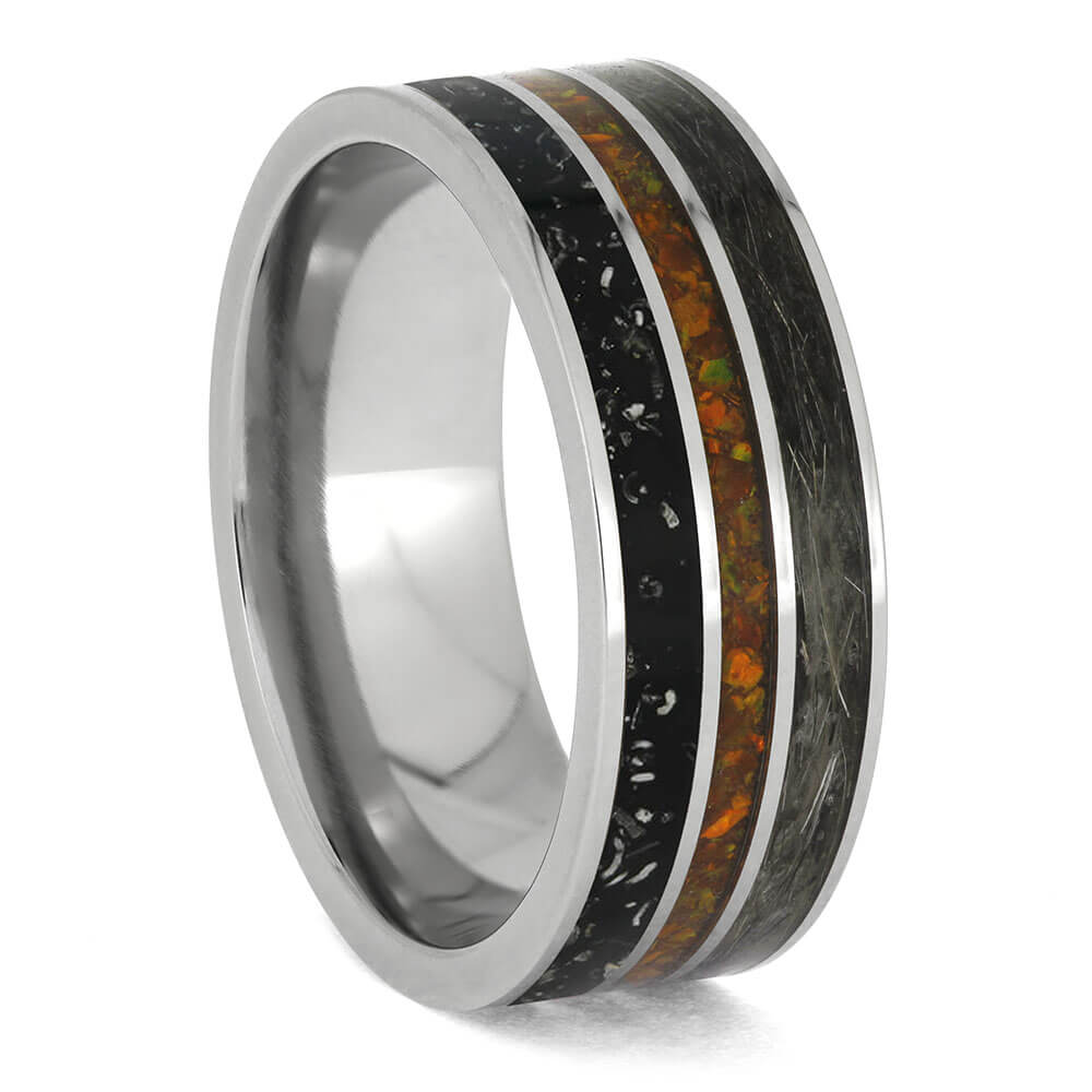 Ring with metallic and multicolored inlay on a white background