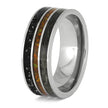Silver ring with black and orange inlay on a white background