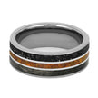 Silver ring with black and orange inlay on a white background