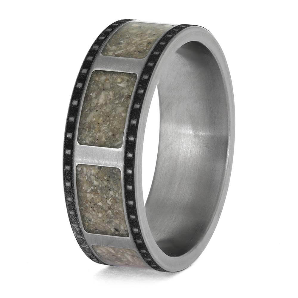Silver ring with embedded stone on a white background