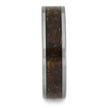 Wooden ring with a metallic band on a white background
