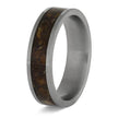 Ring with brown inlay and silver band on a white background
