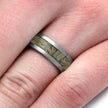 Close-up of a ring with a textured band on a finger