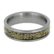 Silver ring with a green leaf-like inlay on a white background