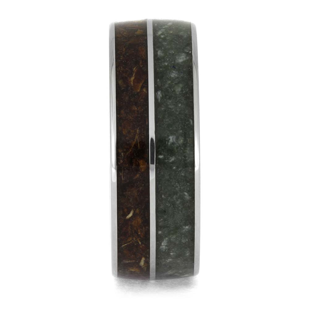 Ring with a dark, textured band on a white background