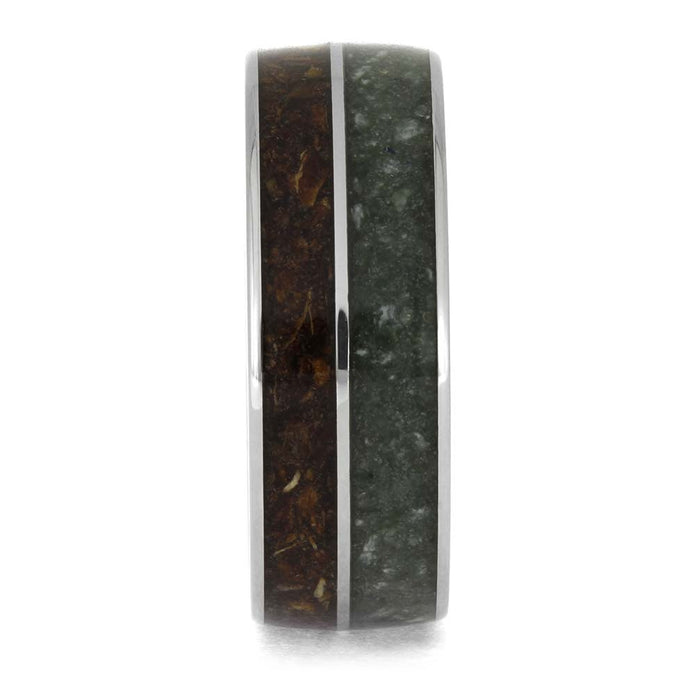 Ring with a dark, textured band on a white background