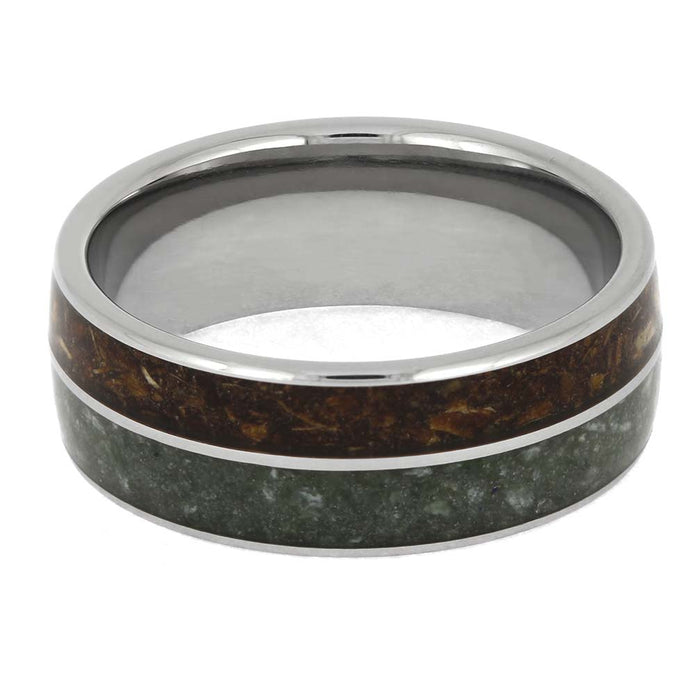 Ring with metallic and wooden inlay on a white background