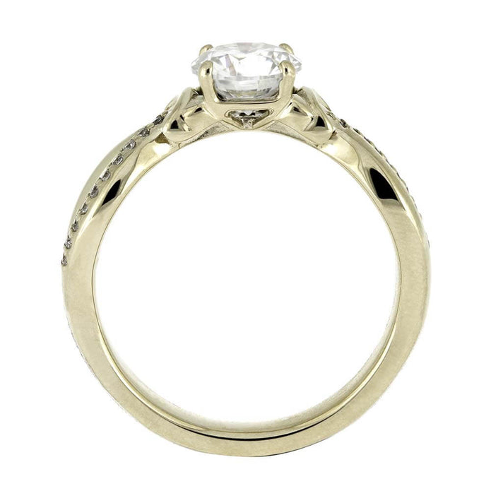 Gold ring with a diamond on a white background