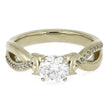 Gold ring with a large diamond and smaller diamonds on the band against a white background