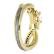 Gold ring with a white gemstone on a white background
