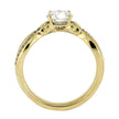 Gold ring with a diamond on a white background