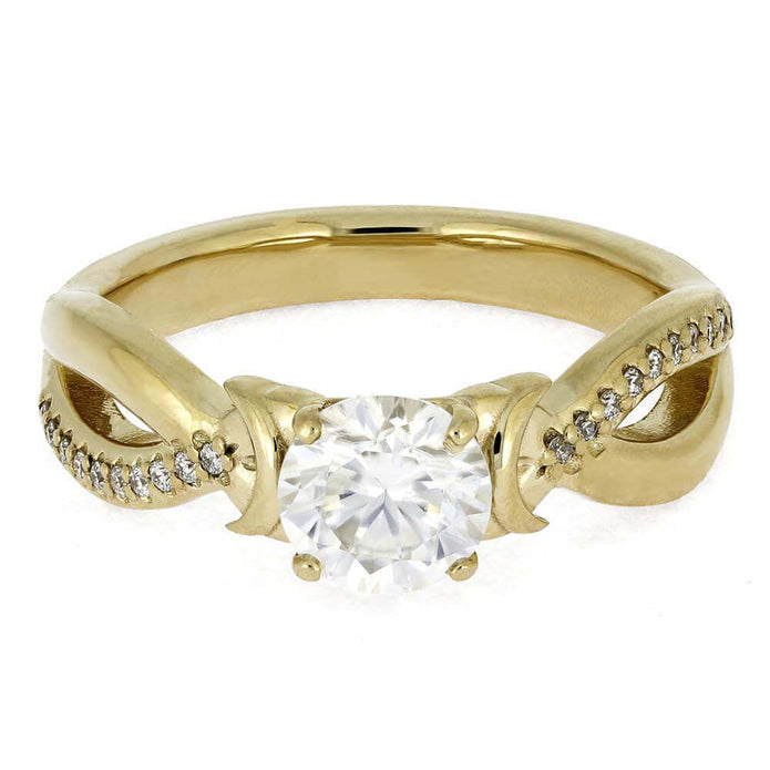 Gold ring with a large diamond and smaller diamonds on the band against a white background