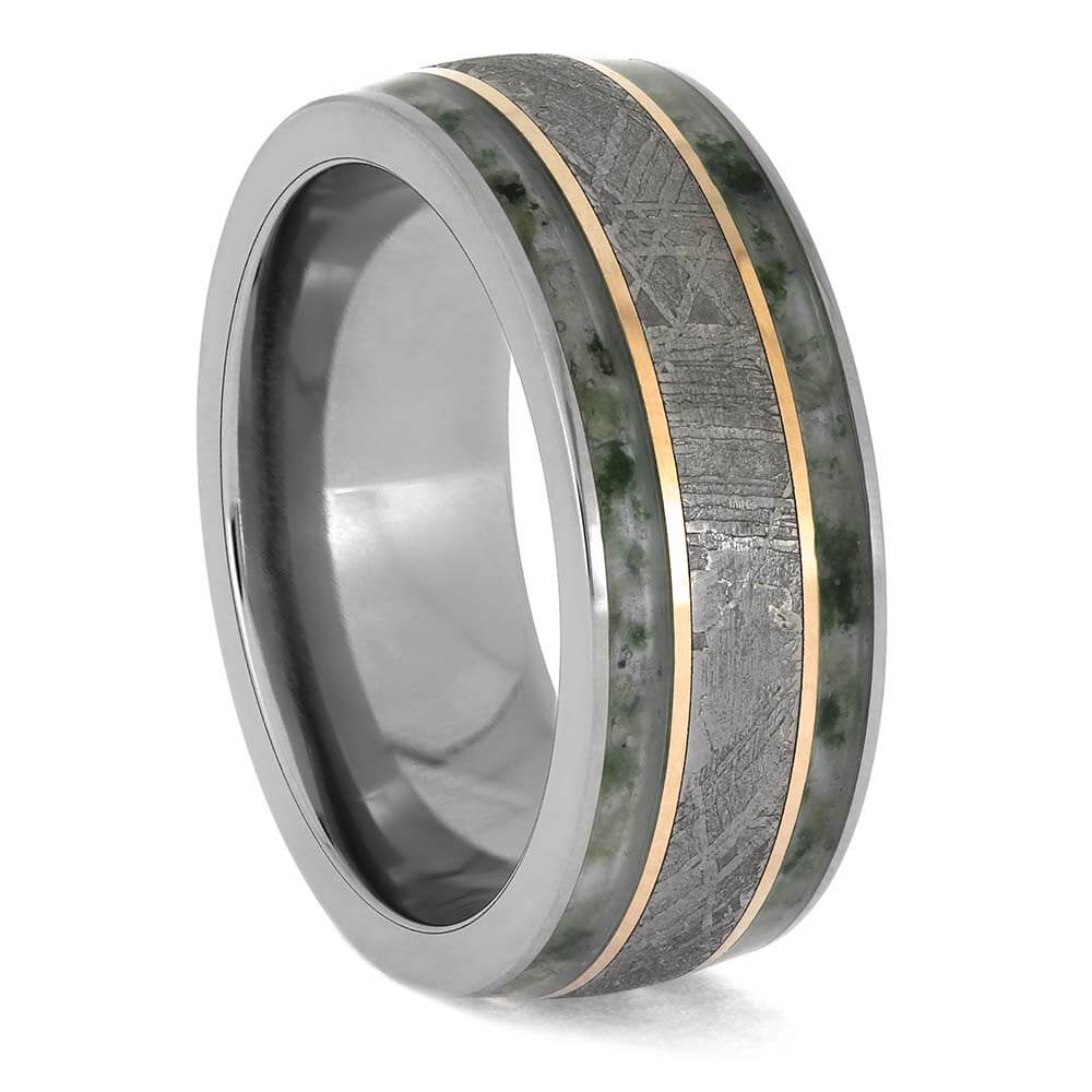 Ring with metallic and stone inlay on a white background