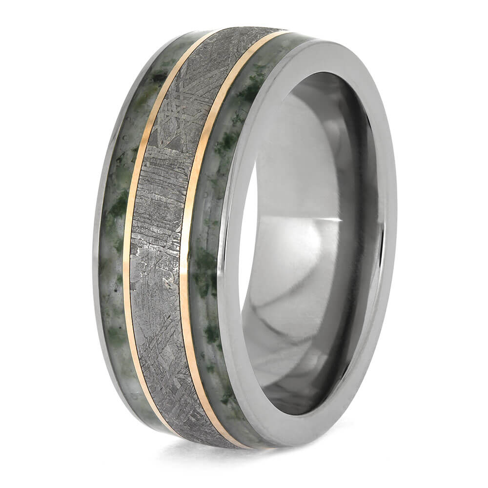 Ring with metallic band and textured inlay on a white background