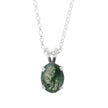 Necklace with a green stone pendant on a white background