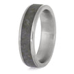 Silver ring with a textured band on a white background