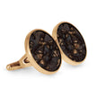 Gold cufflinks with dark stone inlays on a white background