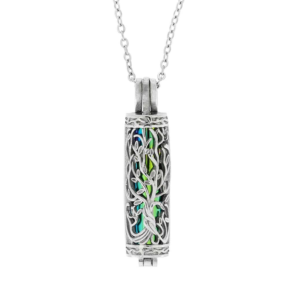 Silver pendant with intricate design and colorful interior on a white background