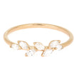 Gold ring with clear gemstones on a white background