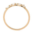 Gold ring with marquise-shaped gemstones on a white background