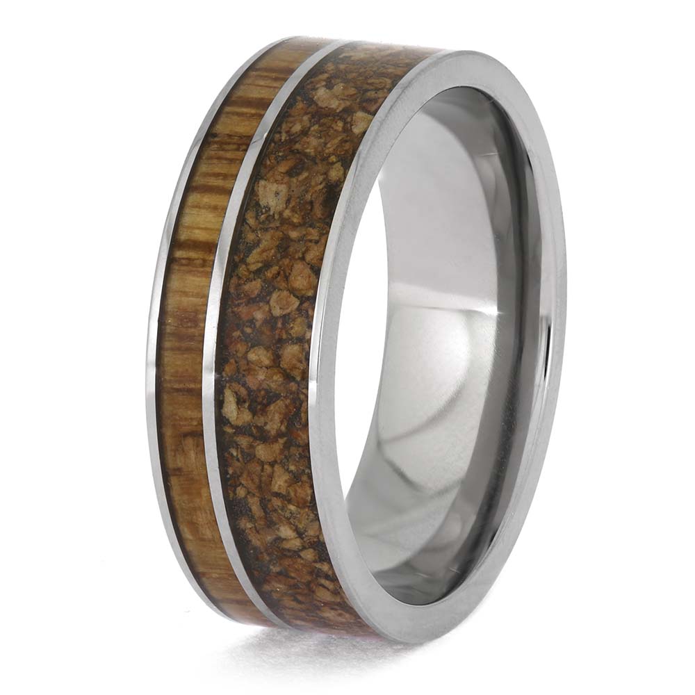 Ring with wooden inlay and silver band on a white background