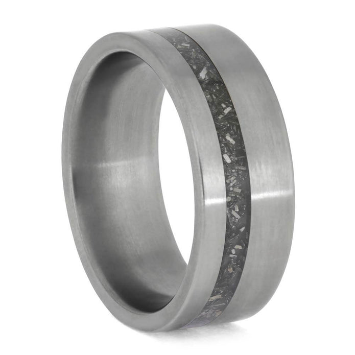 Silver ring with a textured band on a white background