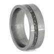 Silver ring with a textured band on a white background