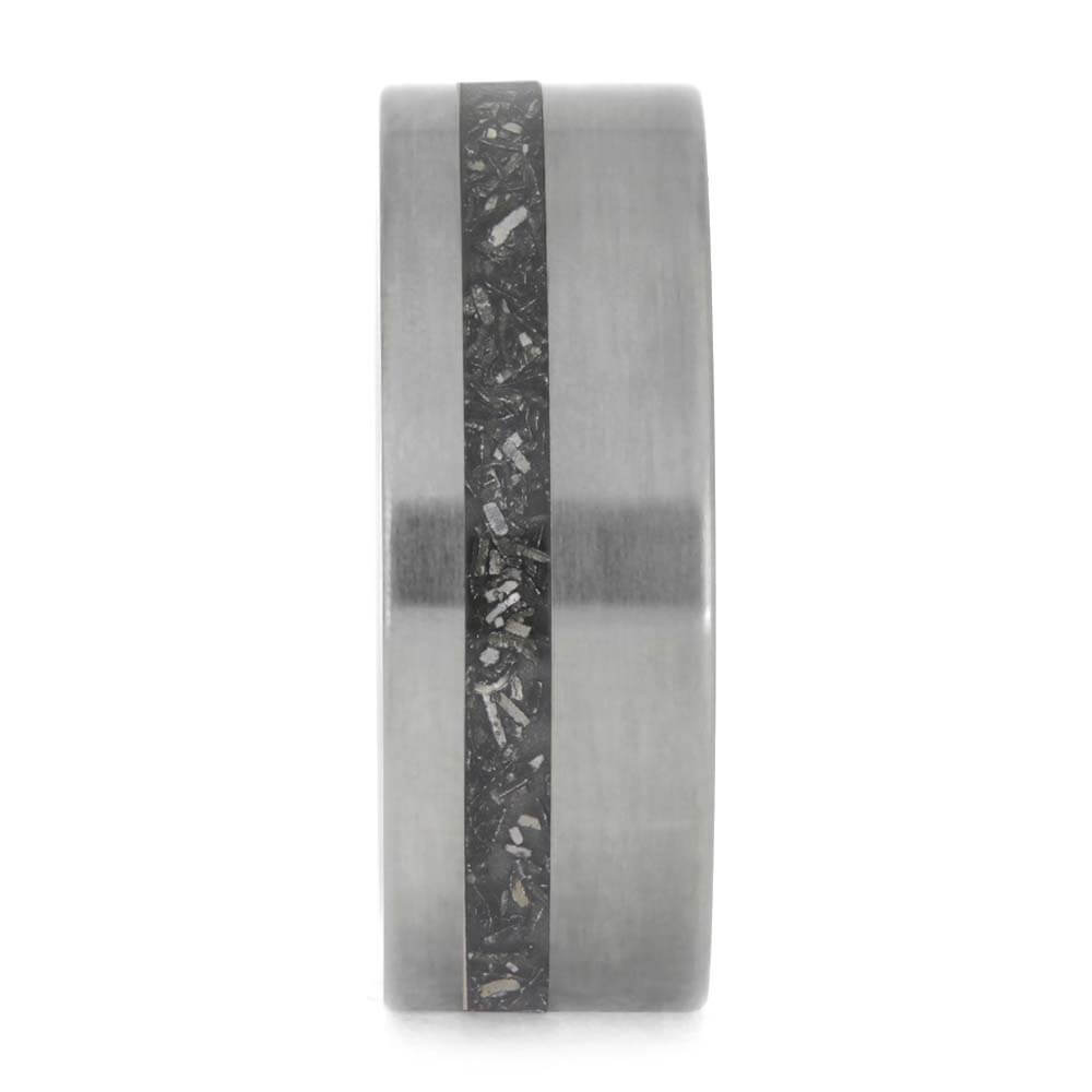 Tungsten ring with a black carbon fiber inlay on a white background