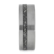 Tungsten ring with a black carbon fiber inlay on a white background